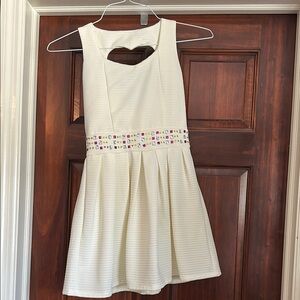 Beautiful cream and colored gem waistline dress only worn once.